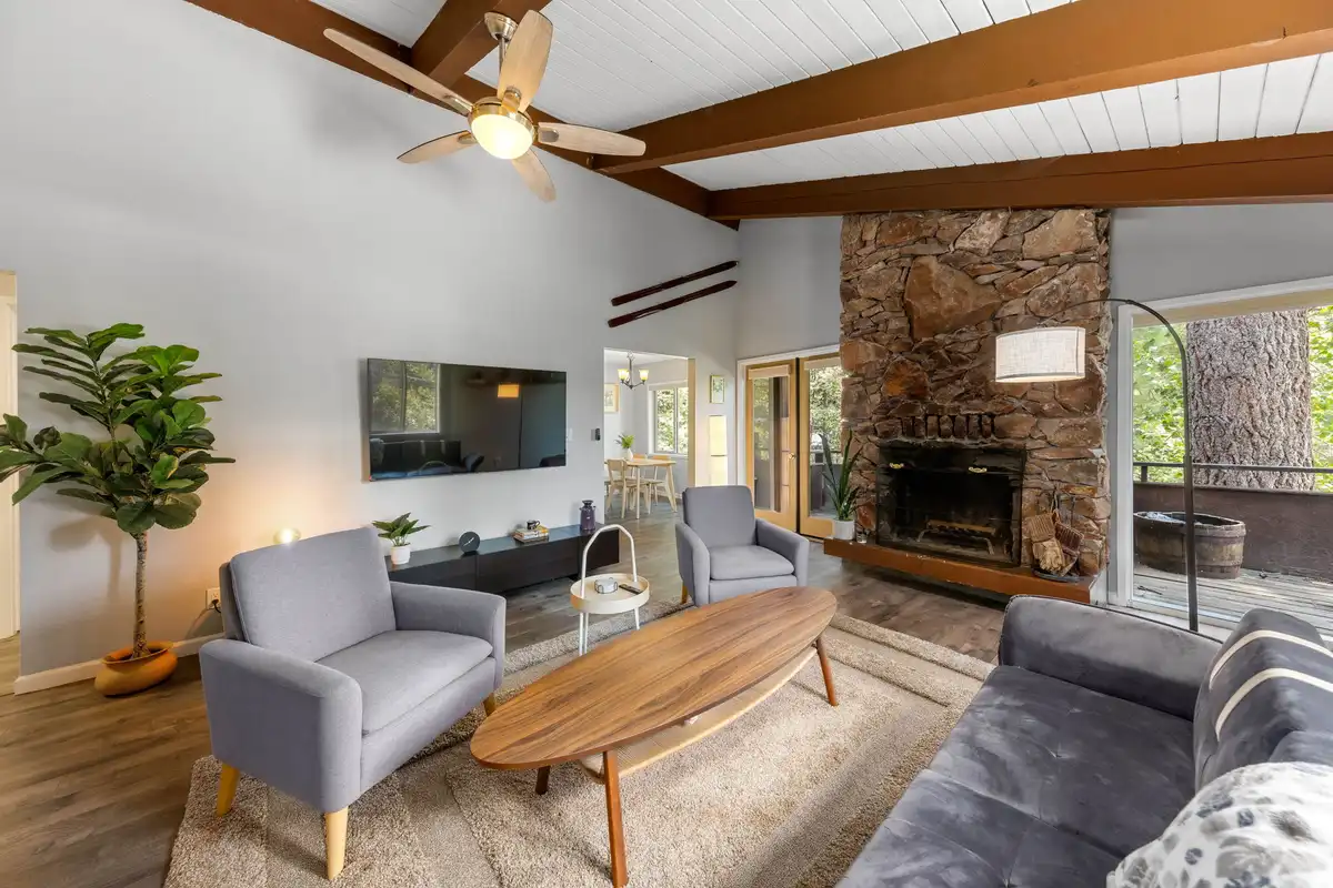 Living room with stone fireplace and beamed ceiling, Incline Tranquil Loft