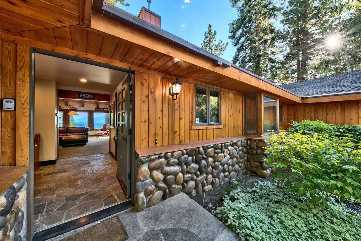 Open front door with stone wall and slate entry, Mammoth Haven Retreat