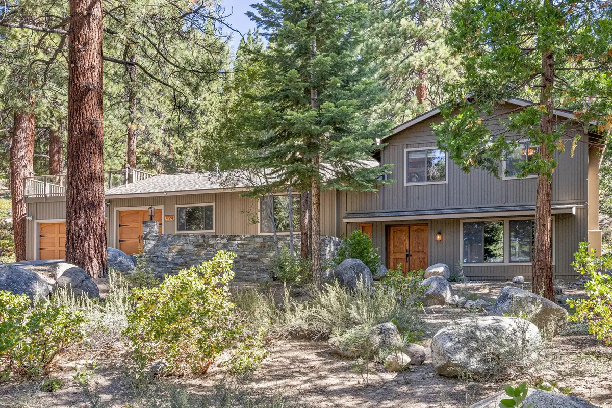 Two-story wood-sided home among pines and boulders, Tranquil Stay