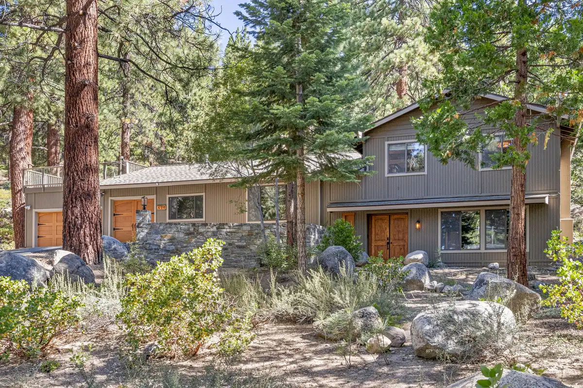 Two-story wood-sided home among pines and boulders, Tranquil Stay