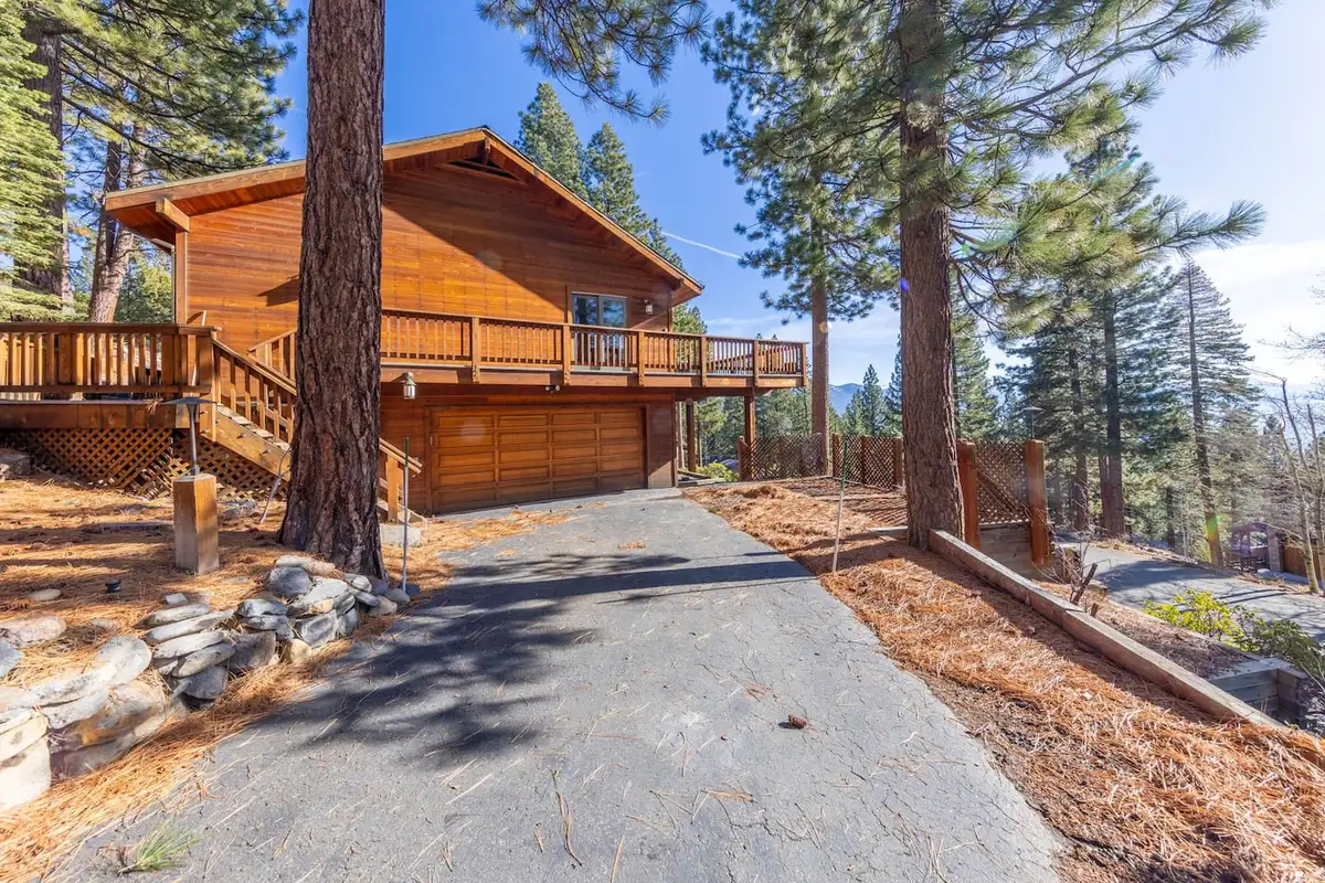 Wood home with a wraparound deck above the garage, Tranquil Alpine Bliss