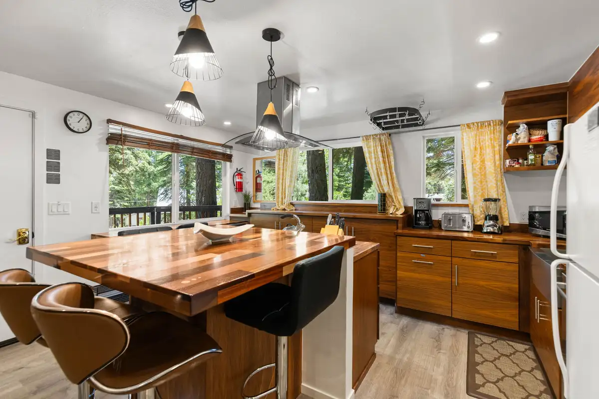 Kitchen with a butcher-block island and pendant lights, Tahoe Lake & Mountain Retreat