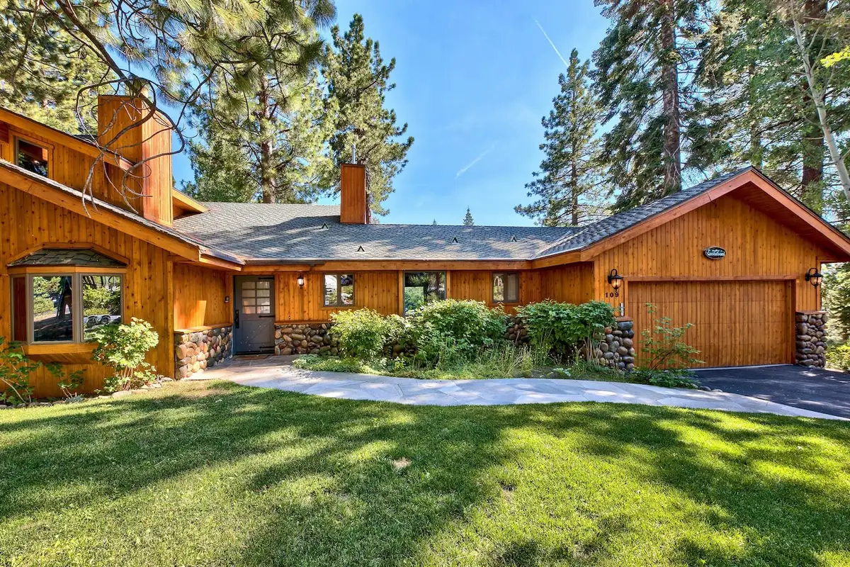 Single-story wood home with garage and lawn, Mammoth Haven Retreat