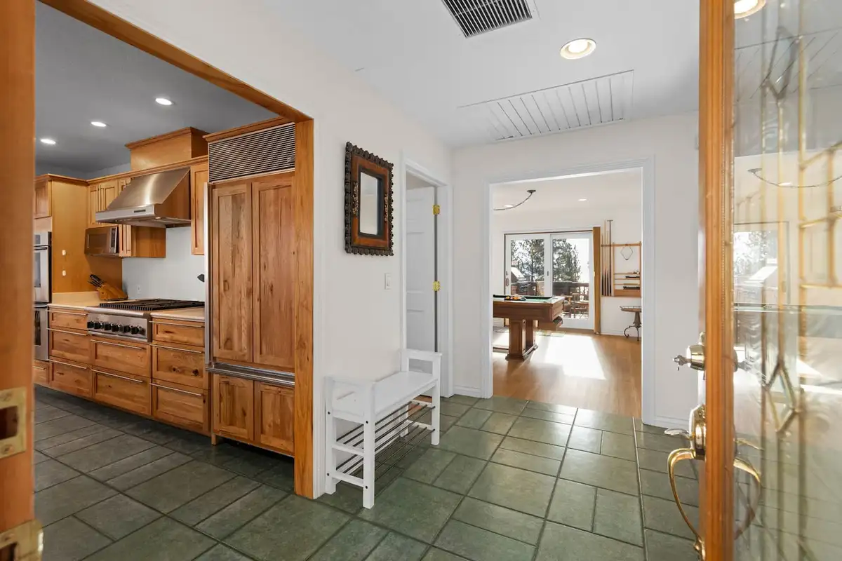 Entry hall with tile floor opening to the kitchen and game room, Tranquil Alpine Bliss