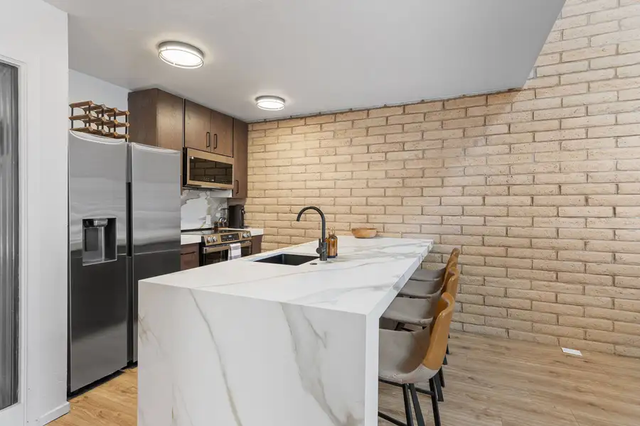 Fully equipped kitchen with stainless steel appliances and marble countertops, Treetop on Country Club
