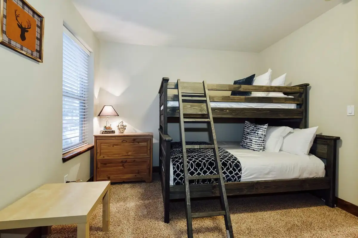 Bedroom with a bunk bed and wood dresser, Trout and About