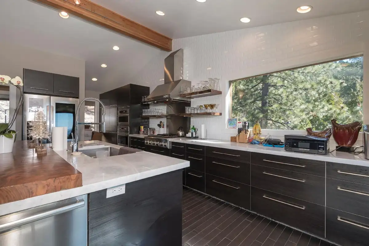 Kitchen with white counters, dark cabinets and range hood, Skylake Serenity Retreat