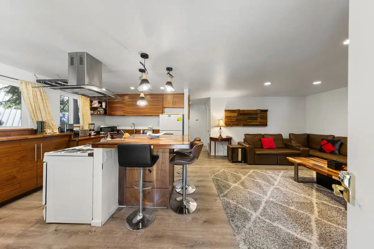 Open kitchen and living area with an island and sectional sofa, Tahoe Lake & Mountain Retreat