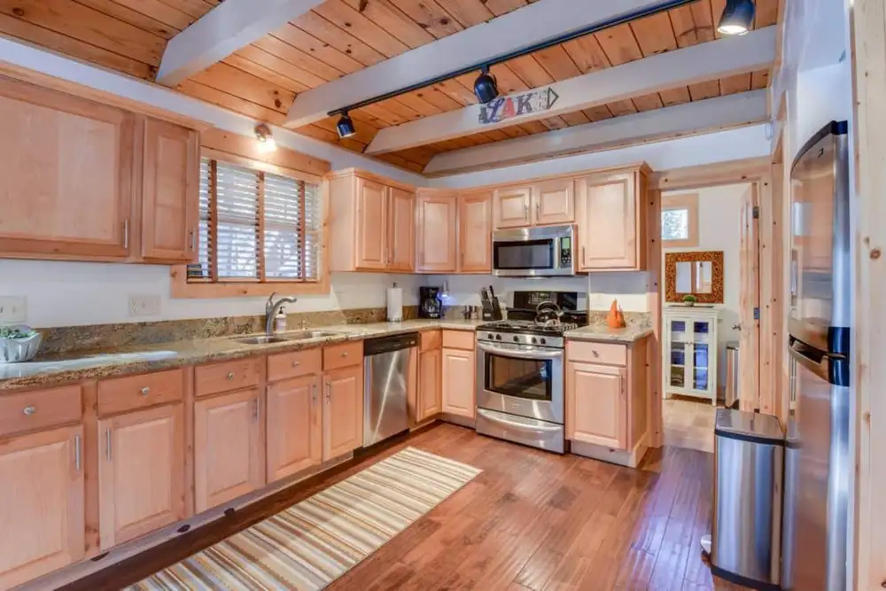 Cooking a meal in the newly renovated, spacious and immaculate kitchen, Tranquil Trails Cabin, an MG home in Tahoma