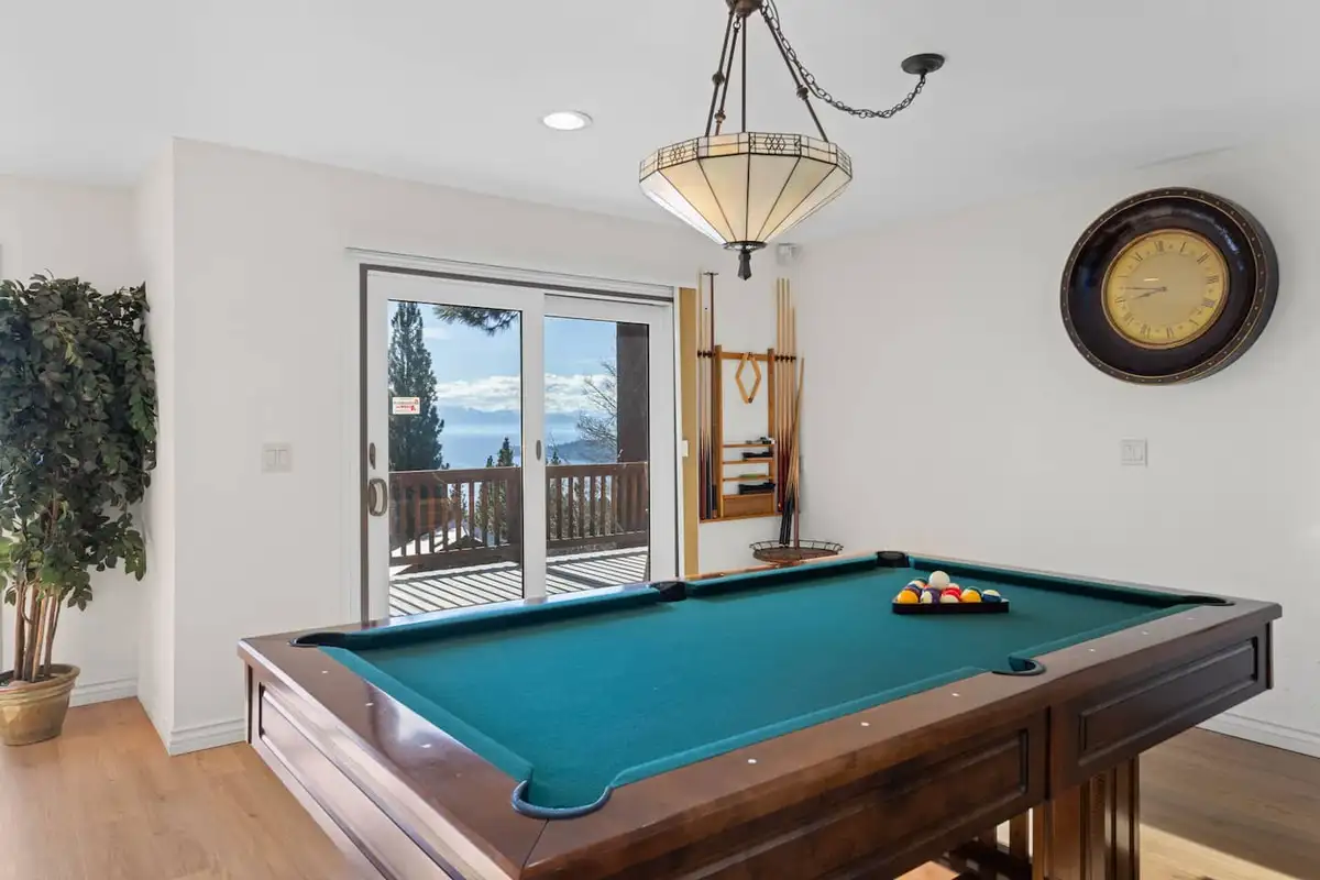 Game room with a pool table and sliding door to a deck, Tranquil Alpine Bliss