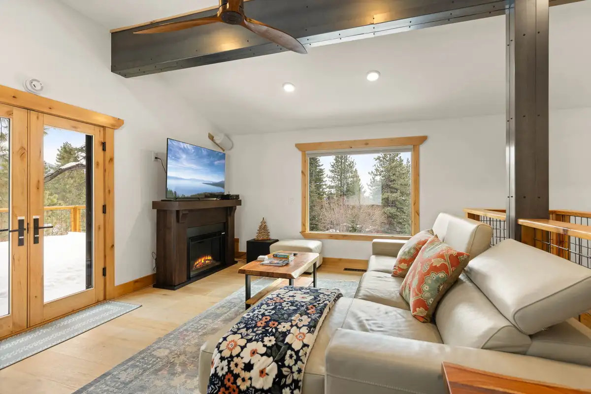 Living room with leather sofa and electric fireplace, Sugar Pine Tahoe Lodge