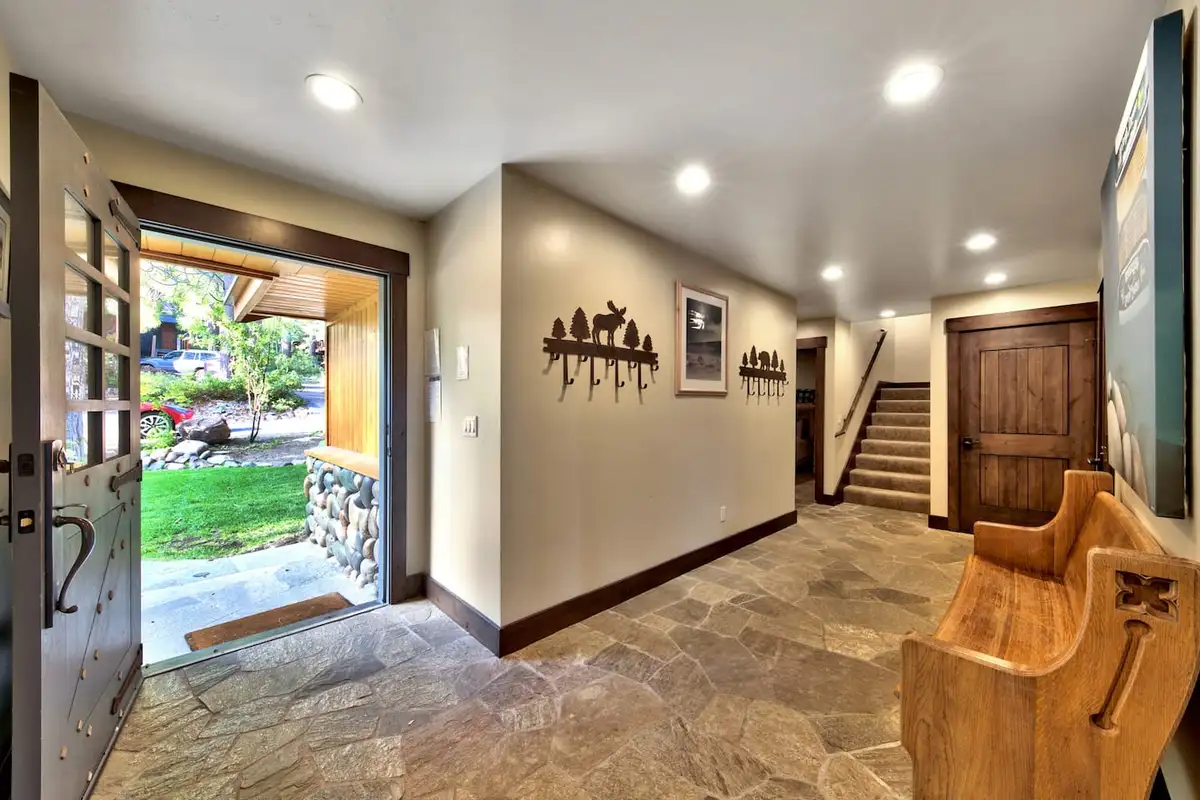 Entry hall with slate floor and open front door, Mammoth Haven Retreat
