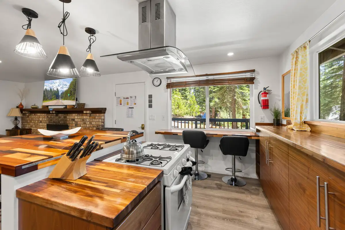 Kitchen with butcher-block counters, gas range and breakfast bar, Tahoe Lake & Mountain Retreat