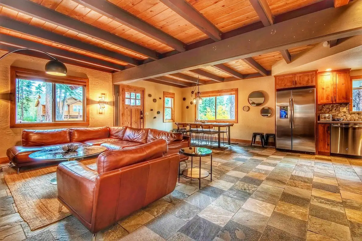 Living room with leather sofas and kitchen beyond, Restful North Ridge
