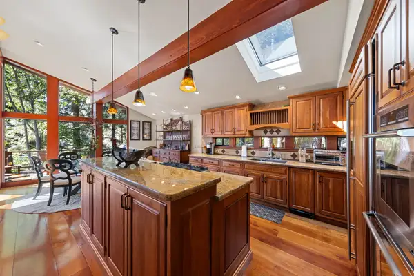 Kitchen with wood cabinets, island and skylight, Incline Lakeside Haven