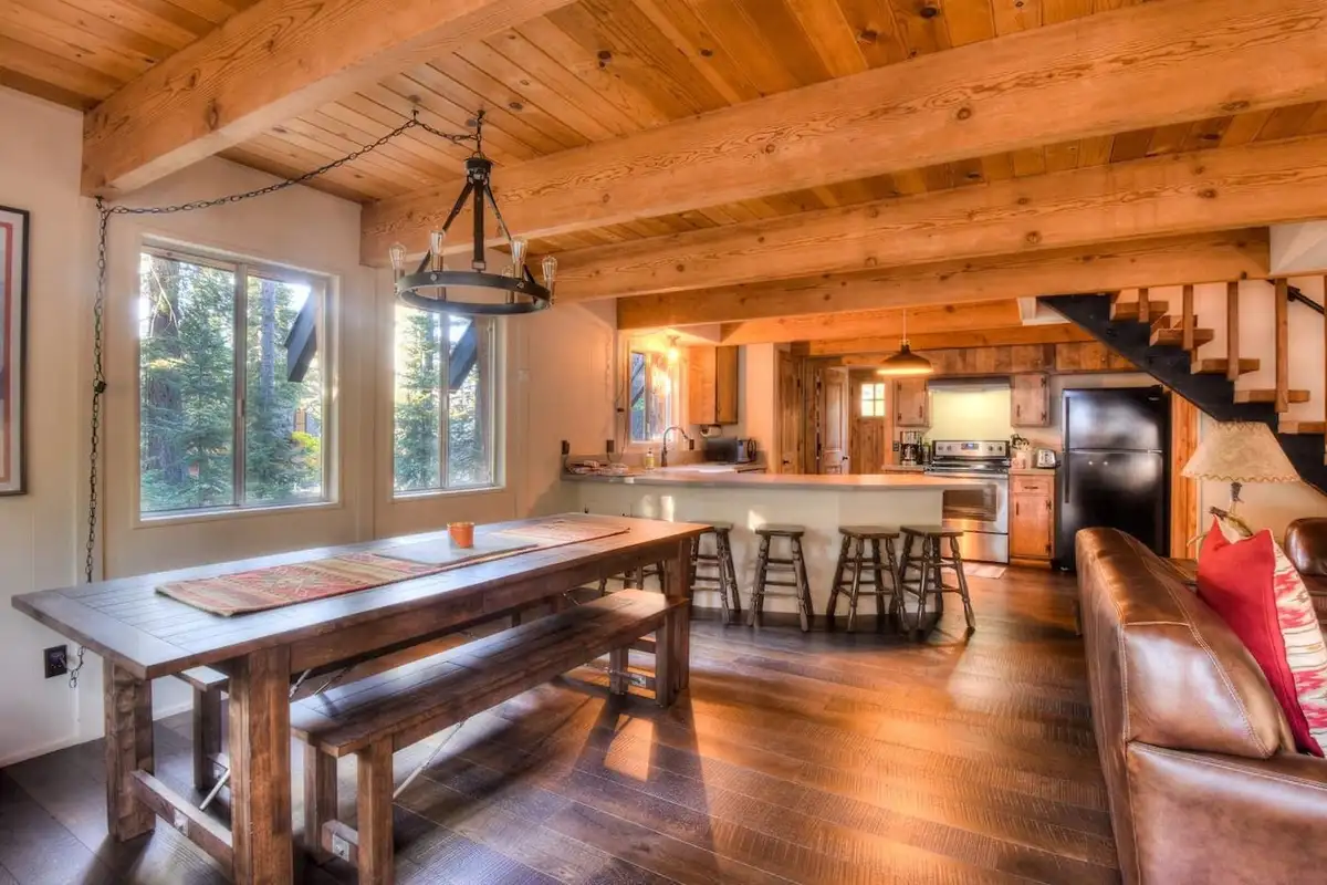 Long farmhouse dining table with benches and kitchen bar, Enchanting Chamberlands Cabin