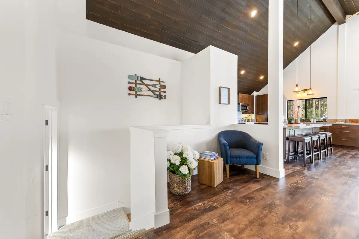 Hallway opening to a kitchen with bar stools, Incline Lakehouse Lookout