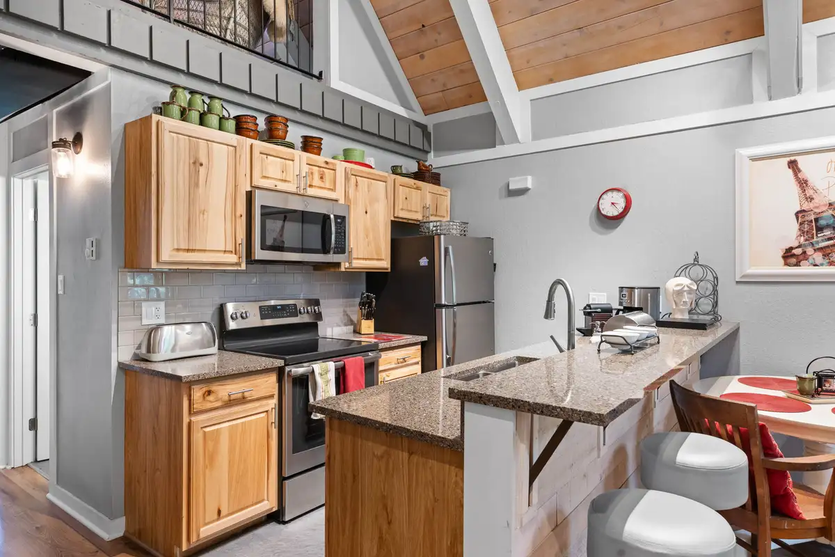 Kitchen with wood cabinets and breakfast bar, Tahoe Peaks & Shores Retreat