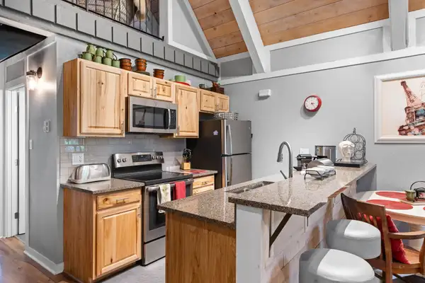 Kitchen with wood cabinets and breakfast bar, Tahoe Peaks & Shores Retreat