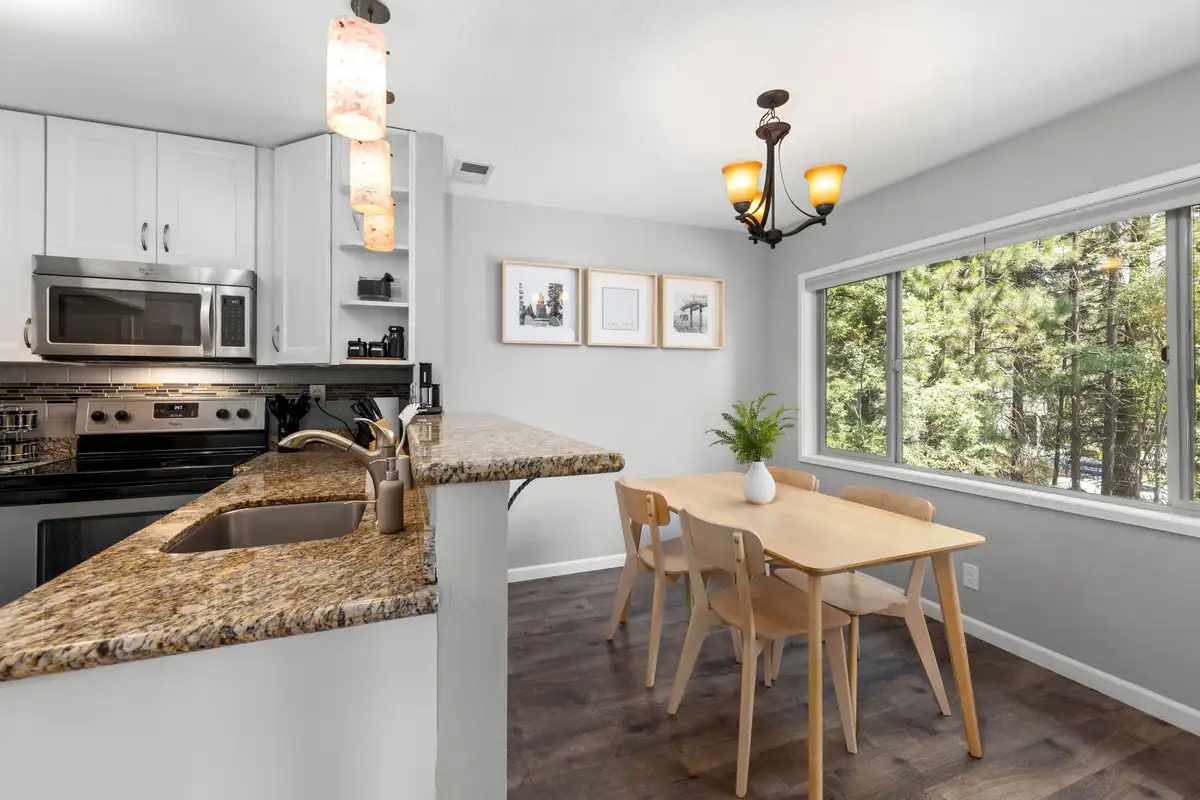 Kitchen with granite counters and dining table by a window, Incline Tranquil Loft