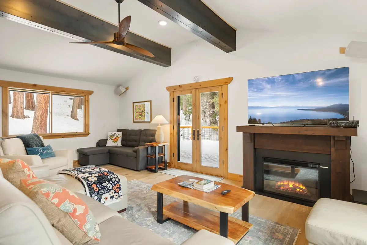Living room with fireplace, TV and French doors, Sugar Pine Tahoe Lodge