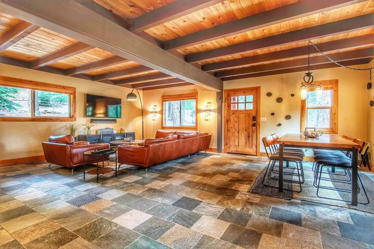 Open living and dining area with beamed wood ceiling, Restful North Ridge