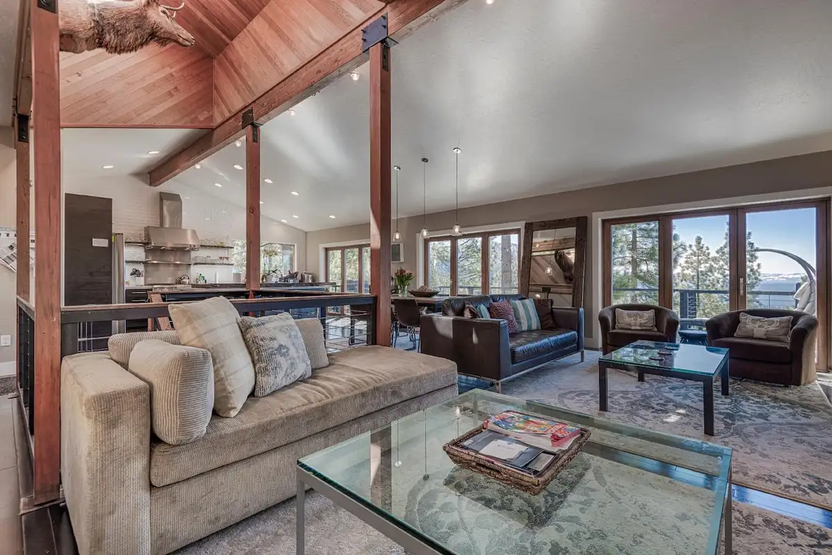 Living room with a vaulted ceiling, sofas and wall of windows, Skylake Serenity Retreat