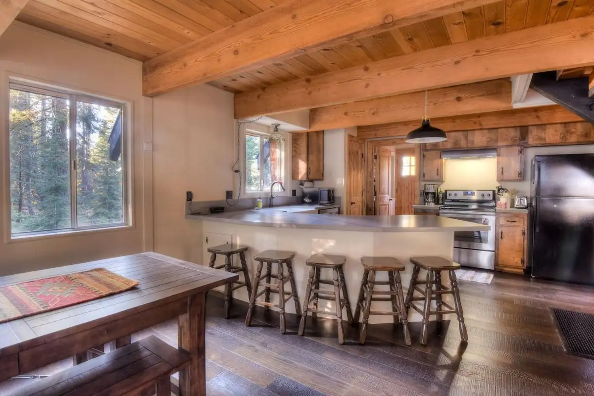 The kitchen is equipped with a drip coffee top, electric stovetop, Enchanting Chamberlands Cabin