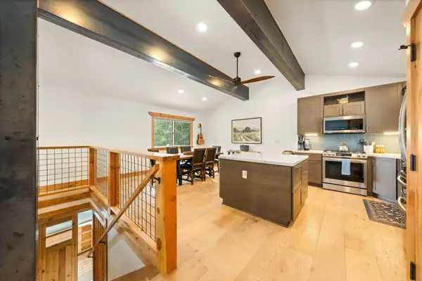 Open kitchen with island and dining area beyond, Sugar Pine Tahoe Lodge