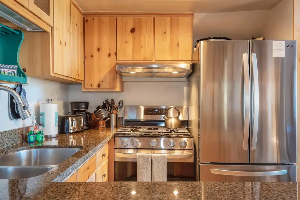 Kitchen with gas range and stainless refrigerator, Lakeview Serenity Cottage