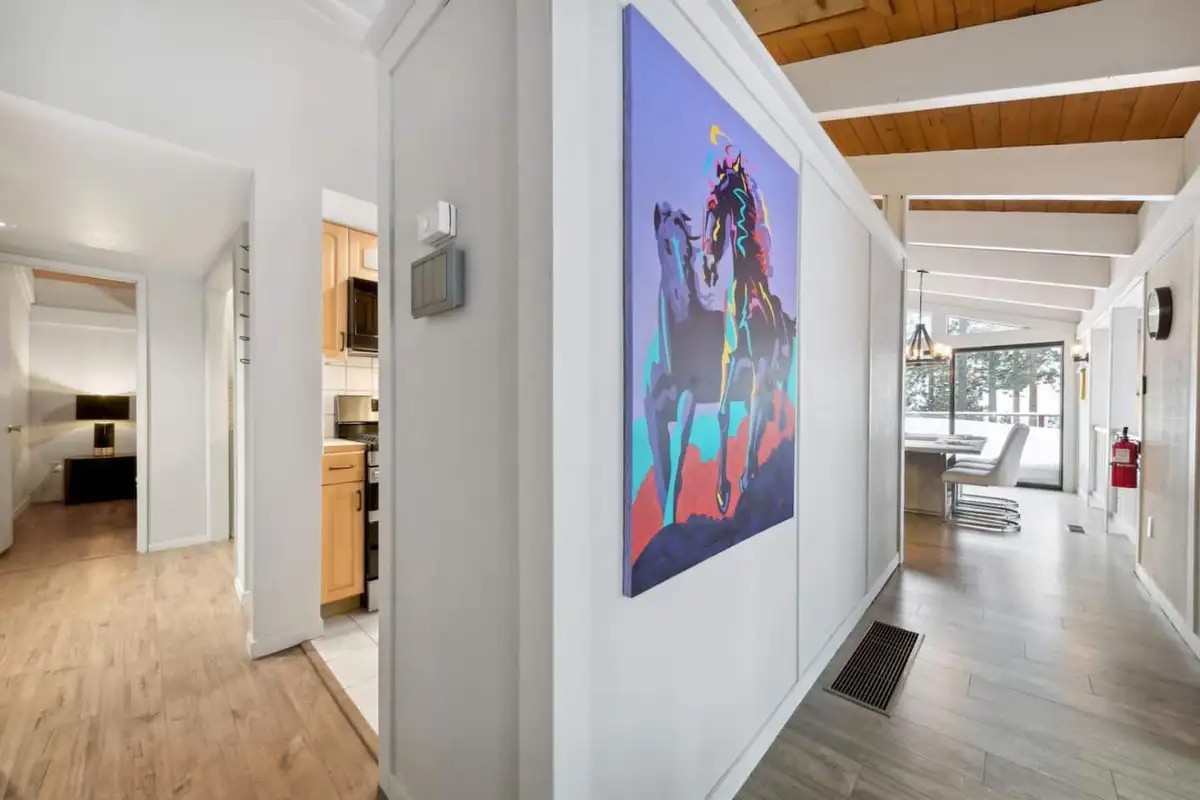 Bright hallway with colorful horse artwork, Lake View Treasure