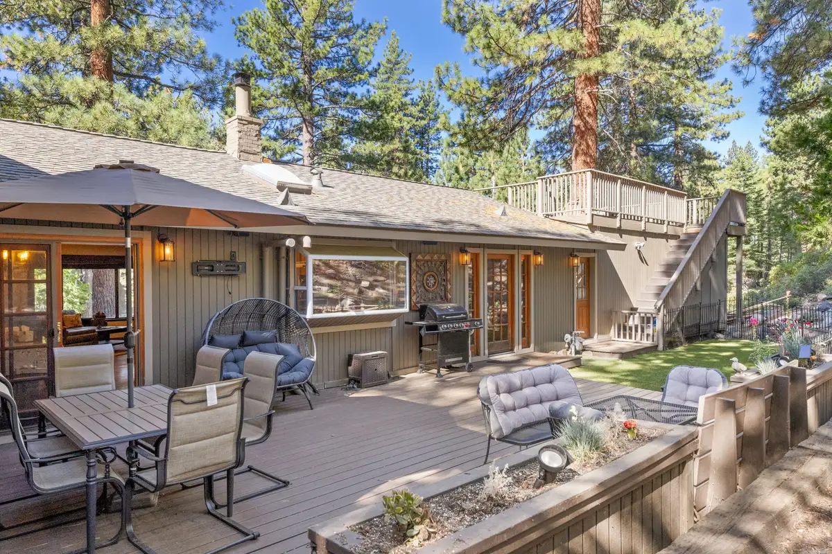 Back deck with patio furniture, umbrella and grill, Tranquil Stay