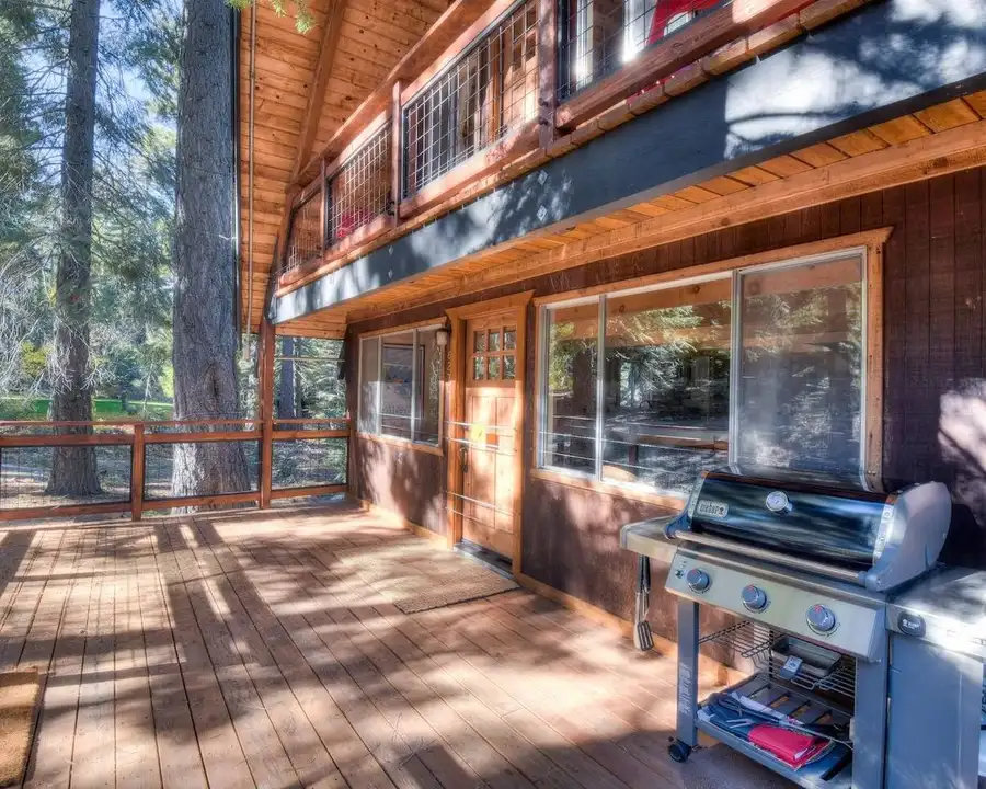 You're welcome by the large deck to enjoy the bracing and fresh Tahoe air, Enchanting Chamberlands Cabin, an MG home in Tahoma