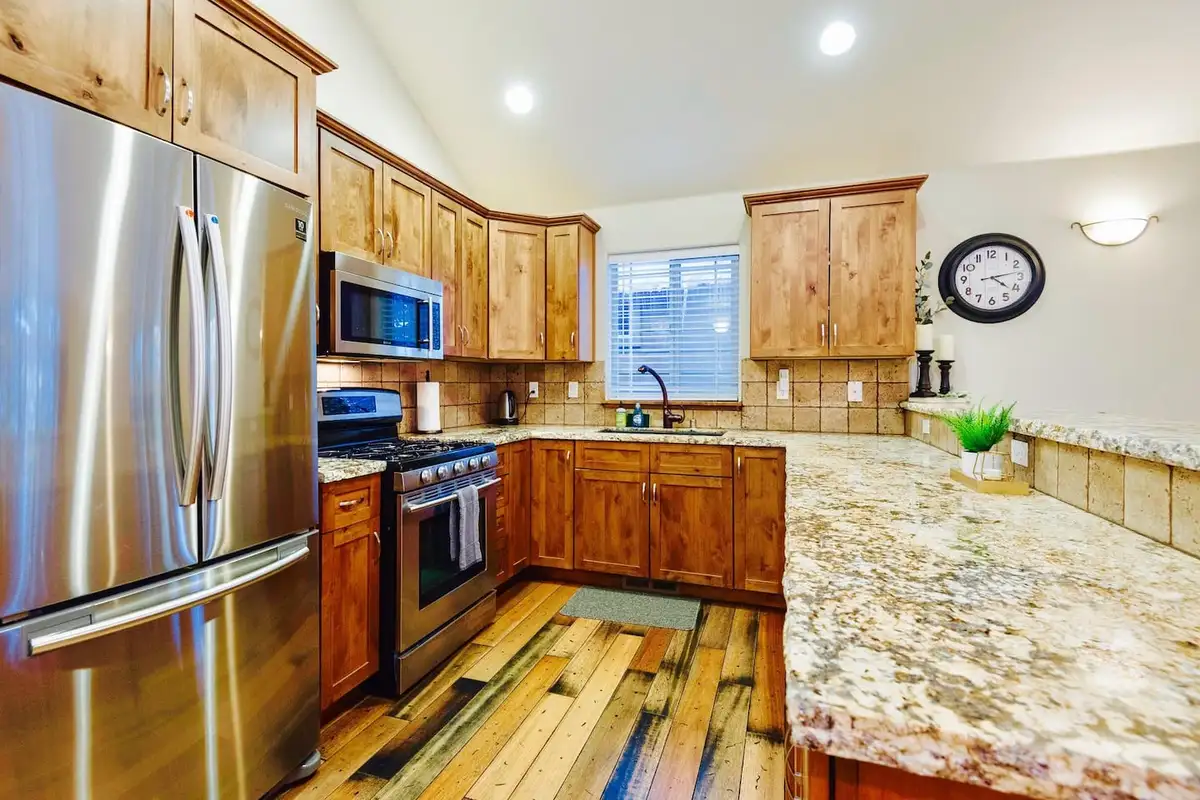 Kitchen with granite counters and stainless appliances, Trout and About
