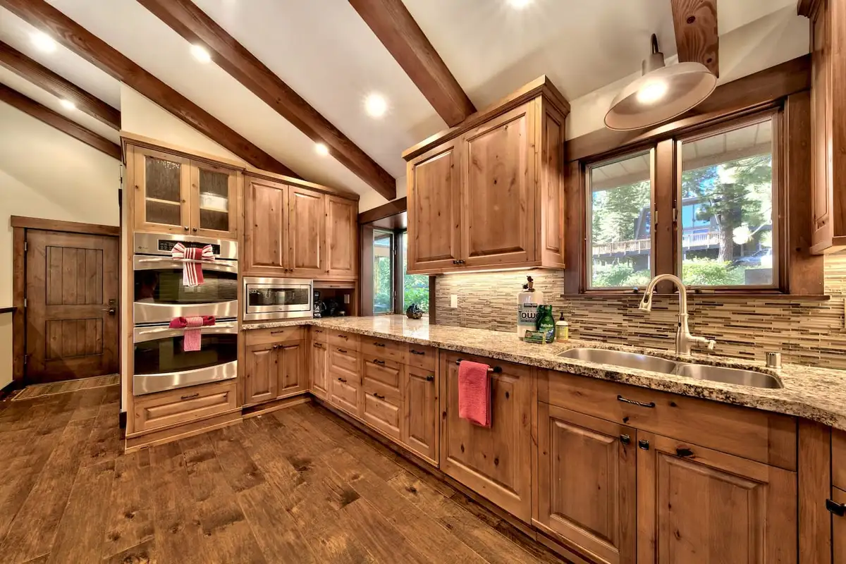 Kitchen with wood cabinets, wall ovens and window sink, Mammoth Haven Retreat