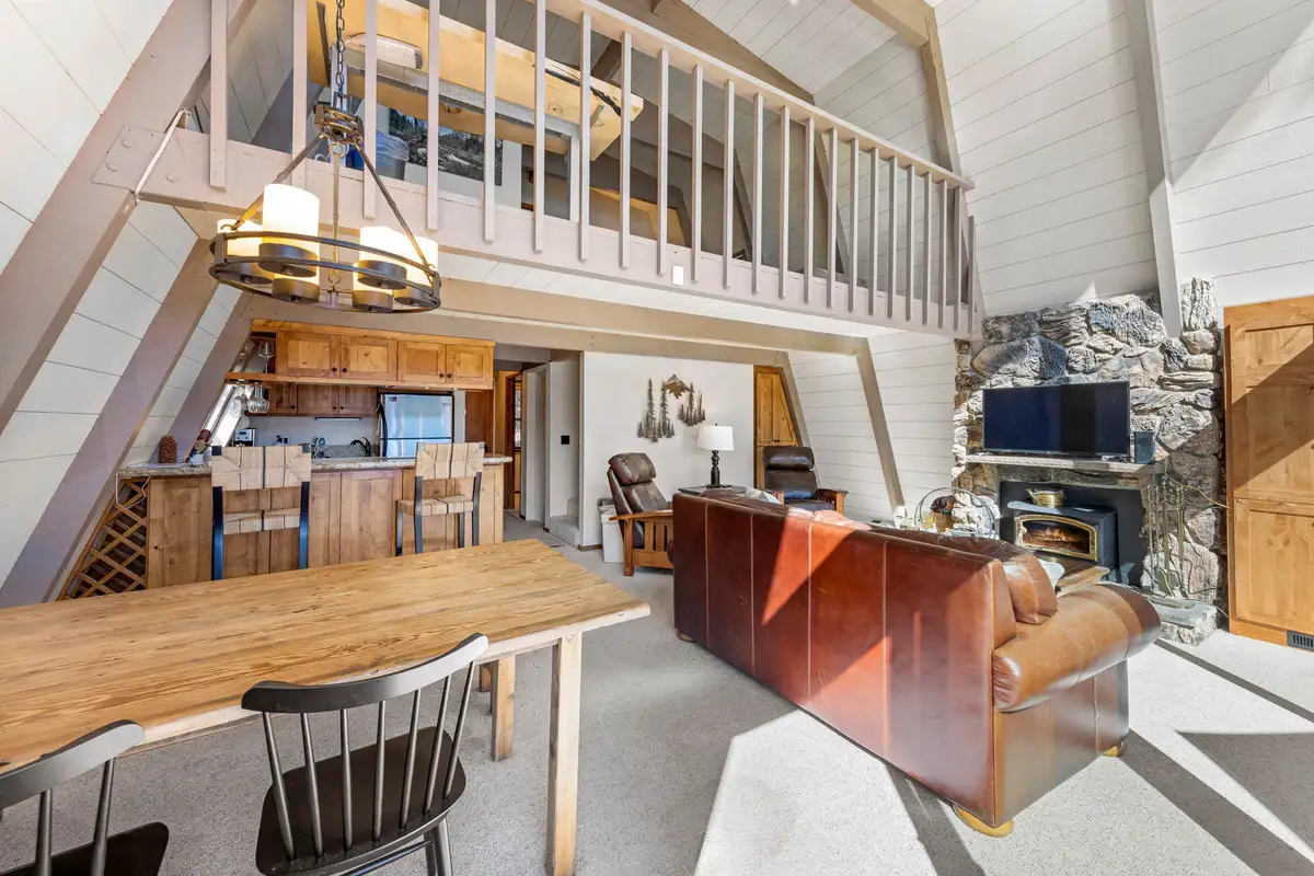 A-frame great room with loft railing and kitchen beyond, Livin' on the Edge
