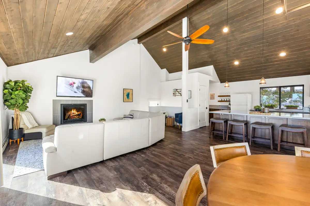 Open living room with fireplace and kitchen island, Incline Lakehouse Lookout
