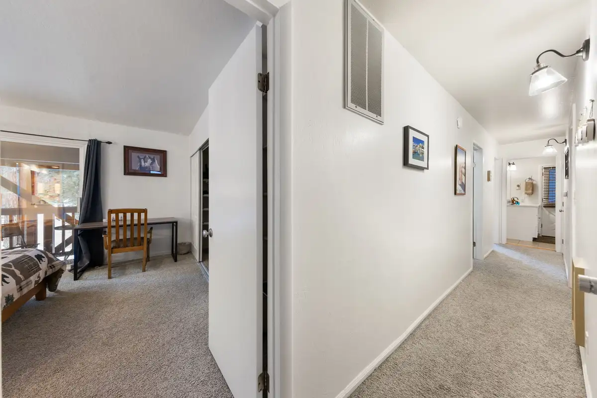 Hallway with carpet and doors to bedrooms, Sierra Woodlands Getaway