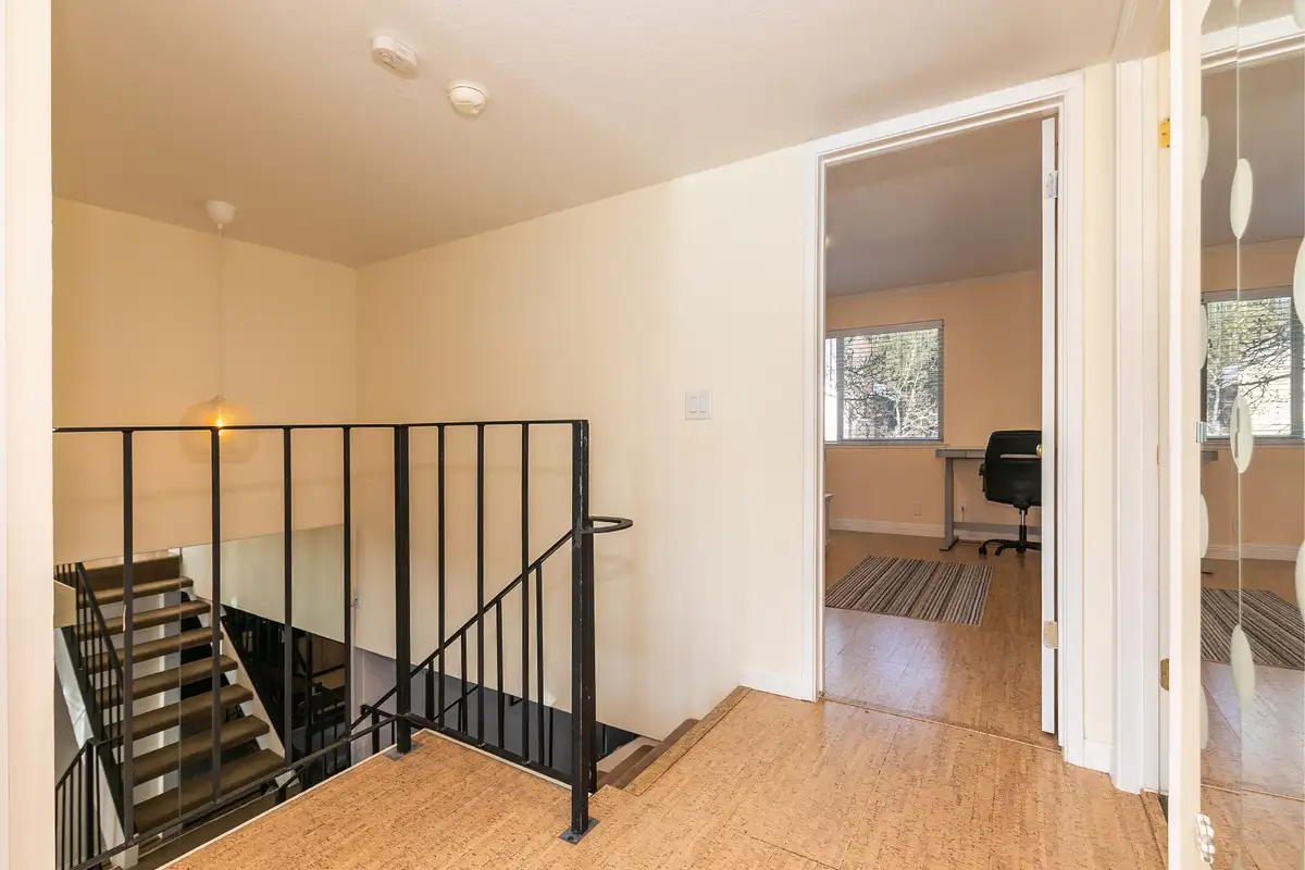Upstairs landing with metal stair railing, Trailside Tahoe Townhouse
