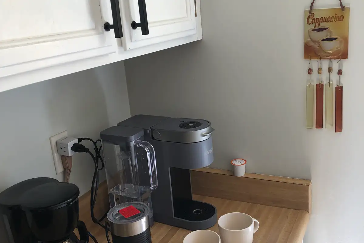 Coffee station with coffee makers and mugs, Skiway Suite