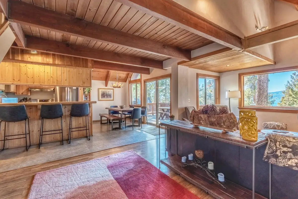 Open living area with wood ceiling and kitchen bar, Lakeview Serenity Cottage