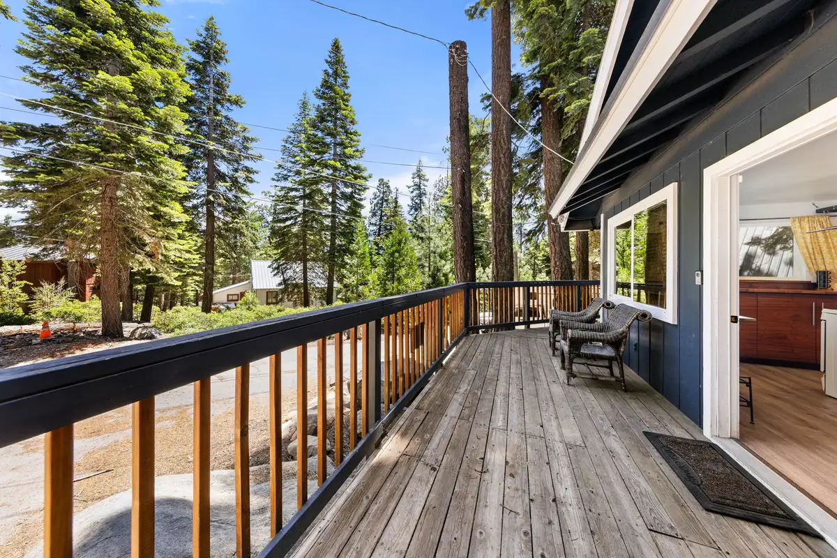 Long wooden deck with railing facing the forest, Tahoe Lake & Mountain Retreat