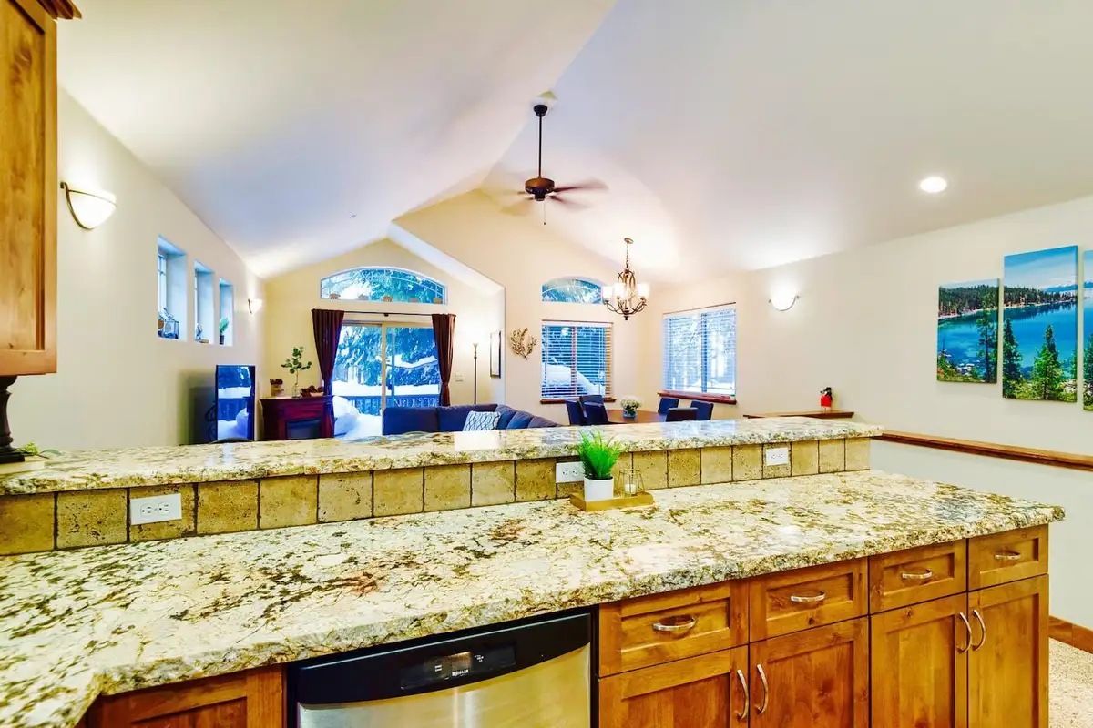 Granite kitchen counter overlooking the vaulted living room, Trout and About