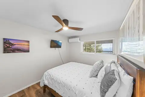 Bedroom with a bed and ceiling fan, Lakeview Haven in Incline Village