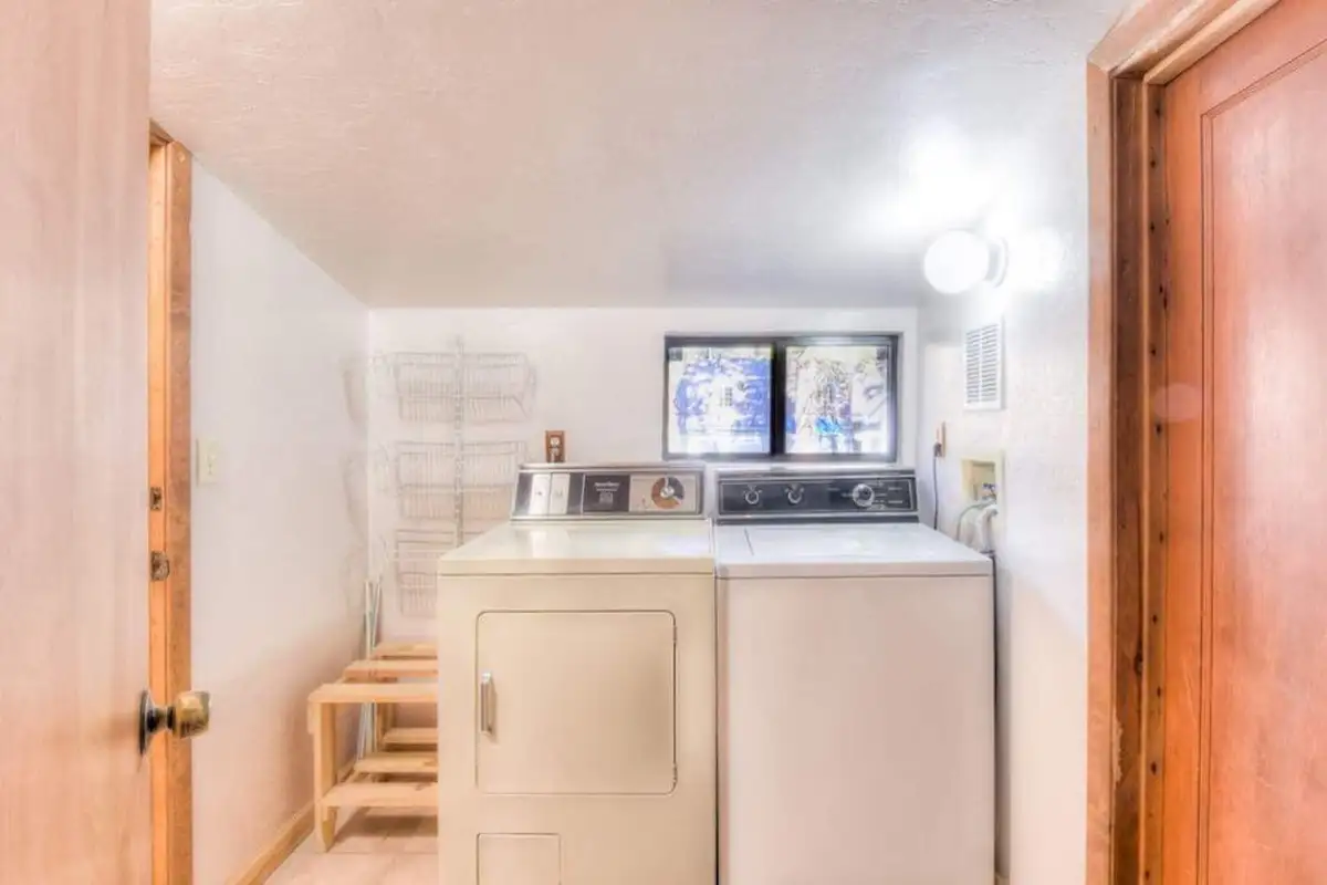 Laundry room with a washer and dryer, Enchanted Woods Cabin