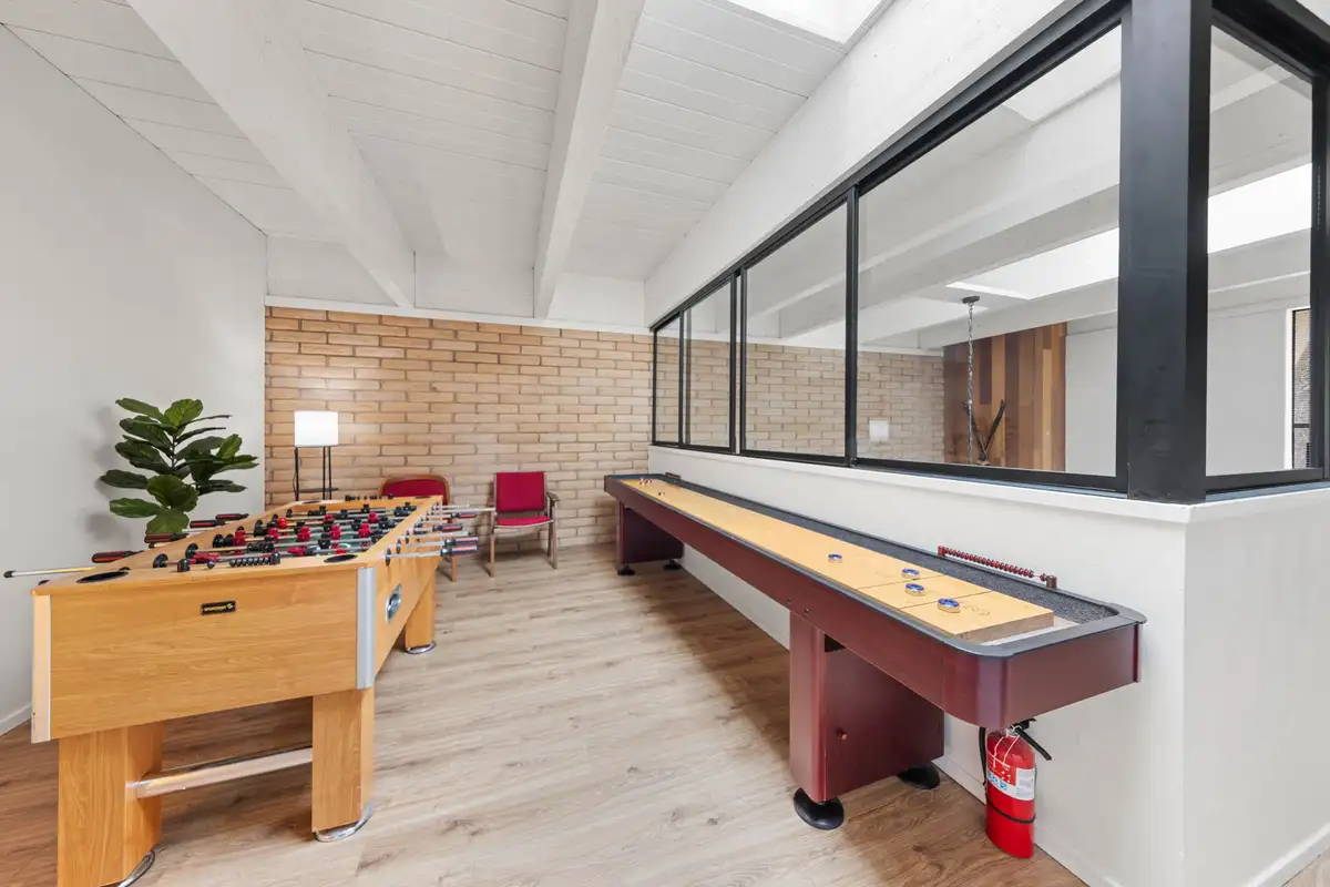 Game room with foosball and shuffleboard tables, Treetop on Country Club