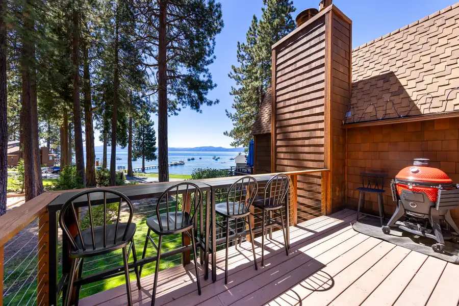 Deck with bar stools, grill and Lake Tahoe beyond, Lakeside Luxe Retreat