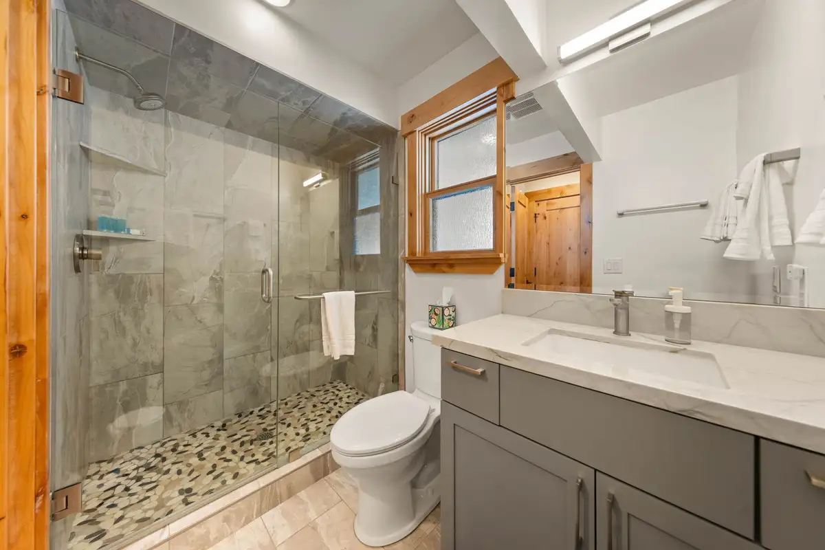 Bathroom with a glass walk-in shower and pebble floor, Sugar Pine Tahoe Lodge