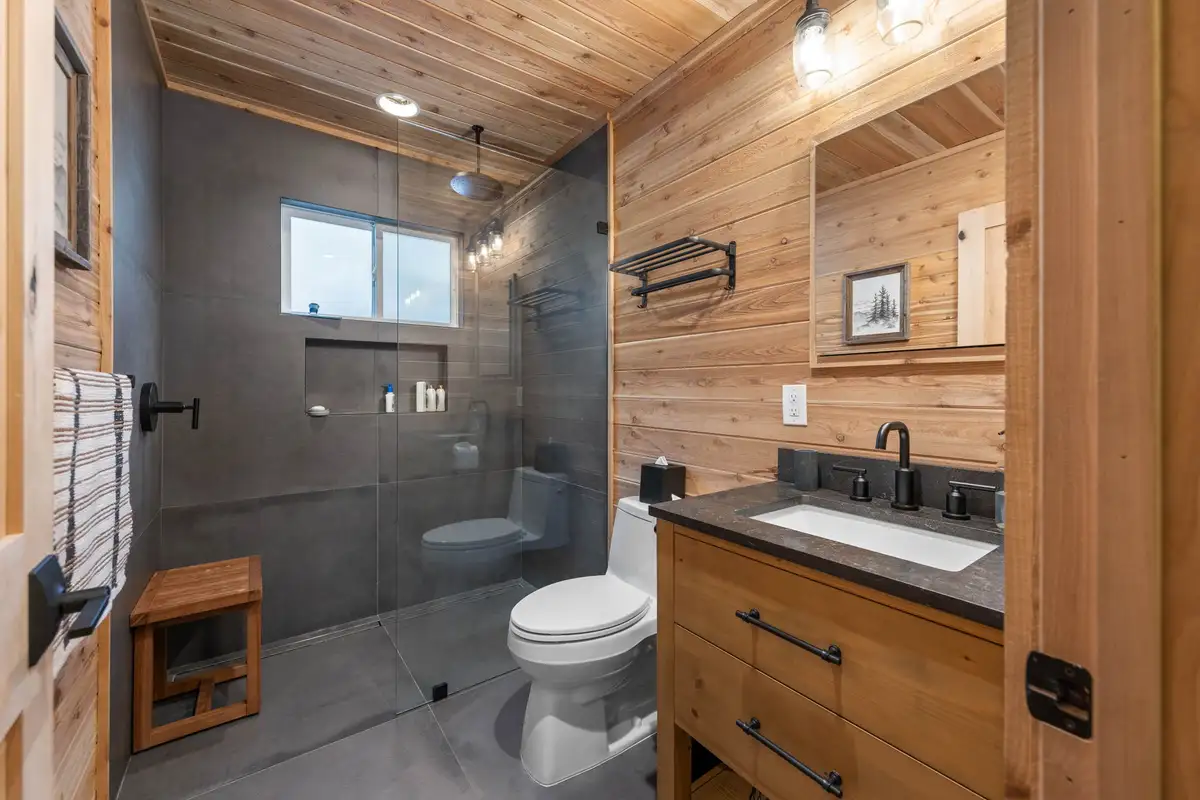 Bathroom with glass shower and wood vanity, Updated West Shore Cabin 1 mile to Chambers Beach