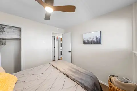 Bedroom with a bed, ceiling fan and open closet, Lakeview Haven in Incline Village